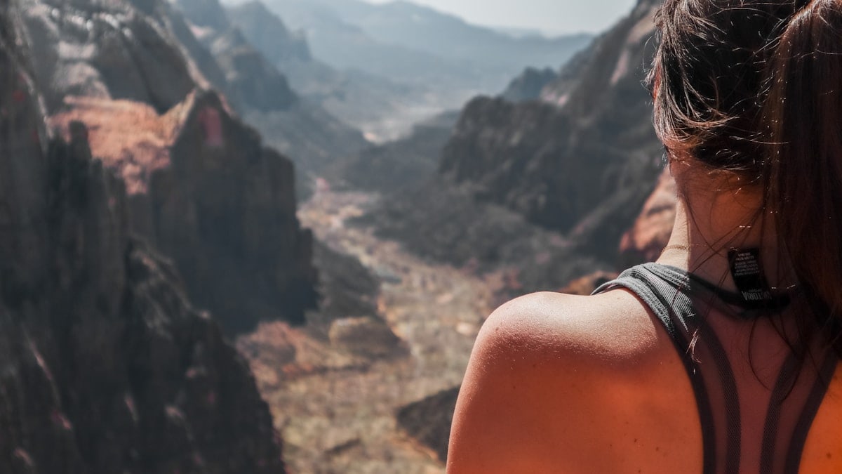person wearing black leather strap watch